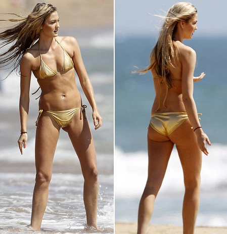 Megan Rossee khiến mọi người chú ý trên bãi biển Santa Monica, Los Angeles, với bộ bikini màu vàng.