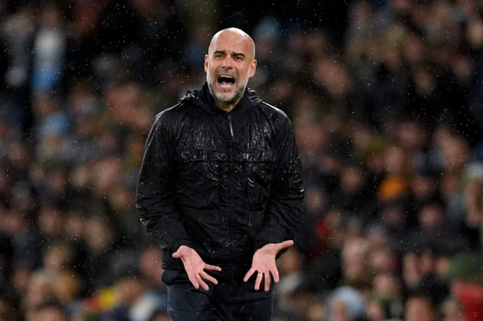 HLV Pep Guardiola phản ứng trong trận Man City thua Liverpool 0-2 trên sân Etihad, Manchester, Anh ngày 23/2. Ảnh: PA