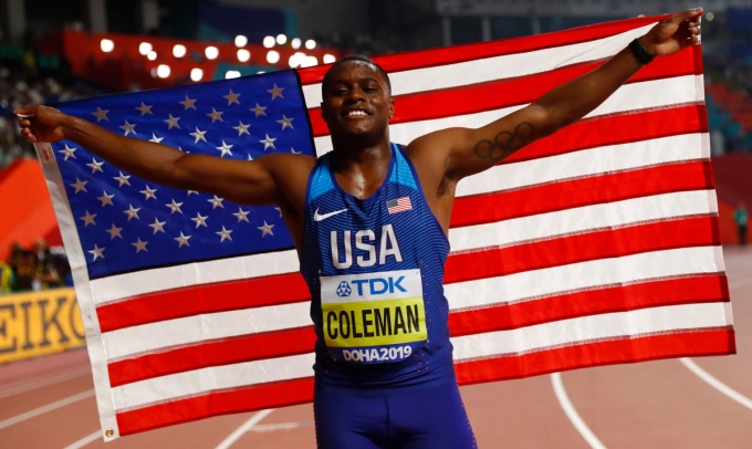 Christian Coleman ăn mừng sau khi giành chức vô địch thế giới nội dung 100m tại Doha năm 2019. Ảnh: Reuters