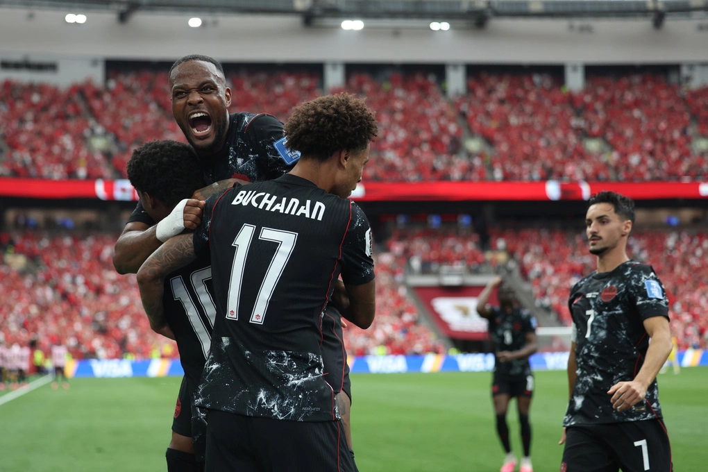 Jonathan David (10) with Cyle Larin (top) and Tajon Buchanan celebrate goal making it 2-0 for Canada in win against Qatar in Group B, World Cup 2026 in Vancouver, British Columbia on June 18. Photo: AP